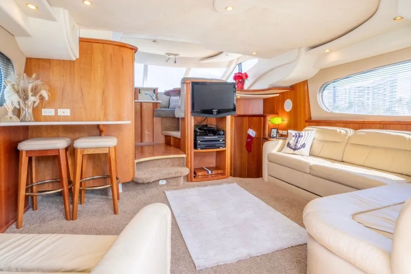 Slide: The Image of Luxurious interior of 2002 Silverton 410 Sport Bridge yacht with plush seating and modern amenities. - 11