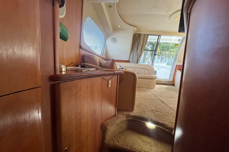 Slide: The Image of Interior of 2002 Silverton 410 Sport Bridge yacht with plush seating and wood accents. - 38