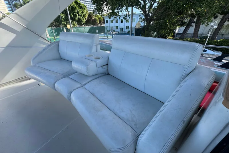 Slide: The Image of White leather seating on a 2002 Silverton 410 Sport Bridge yacht. - 13