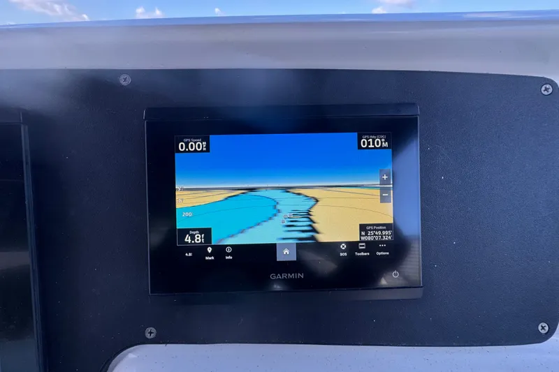 Slide: The Image of Garmin GPS display on 2002 Silverton 410 Sport Bridge showing navigation data. - 19