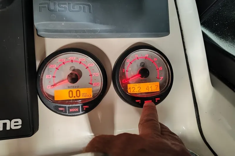 Slide: The Image of Close-up of 2022 Boston Whaler 240 Vantage dashboard gauges showing speed and RPM readings. - 23