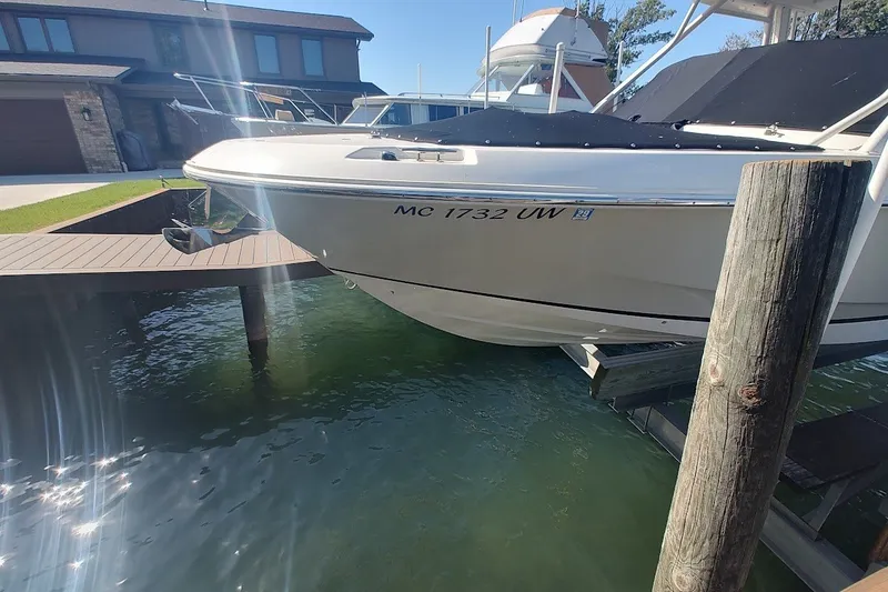 Slide: The Image of 2022 Boston Whaler 240 Vantage docked, showcasing sleek design and modern features. - 25