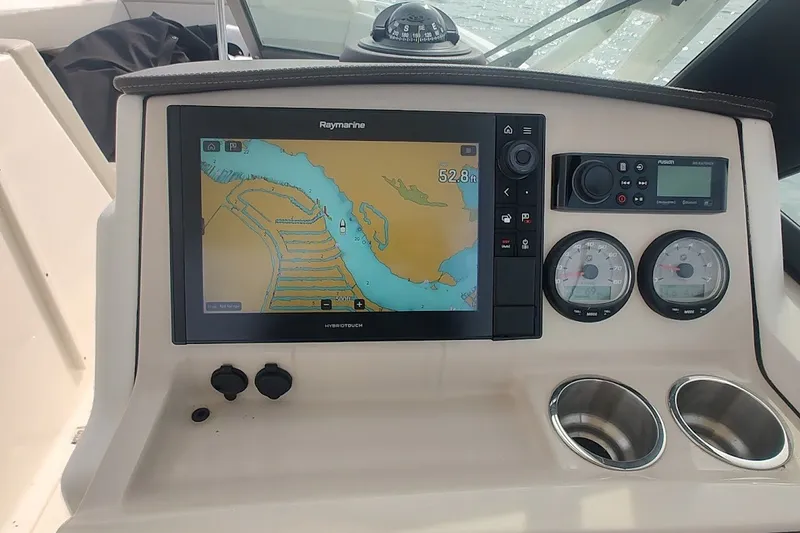 Slide: The Image of Dashboard of a 2022 Boston Whaler 240 Vantage with navigation system and gauges. - 32