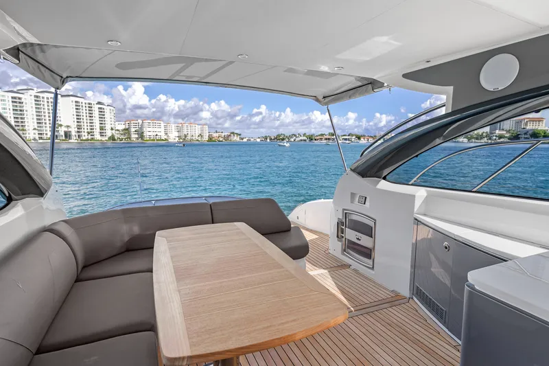 Slide: The Image of Luxurious 2022 Princess V50 yacht interior with ocean view and modern seating area. - 13