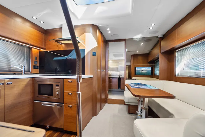 Slide: The Image of Luxurious interior of 2022 Princess V50 yacht with modern kitchen and dining area. - 24