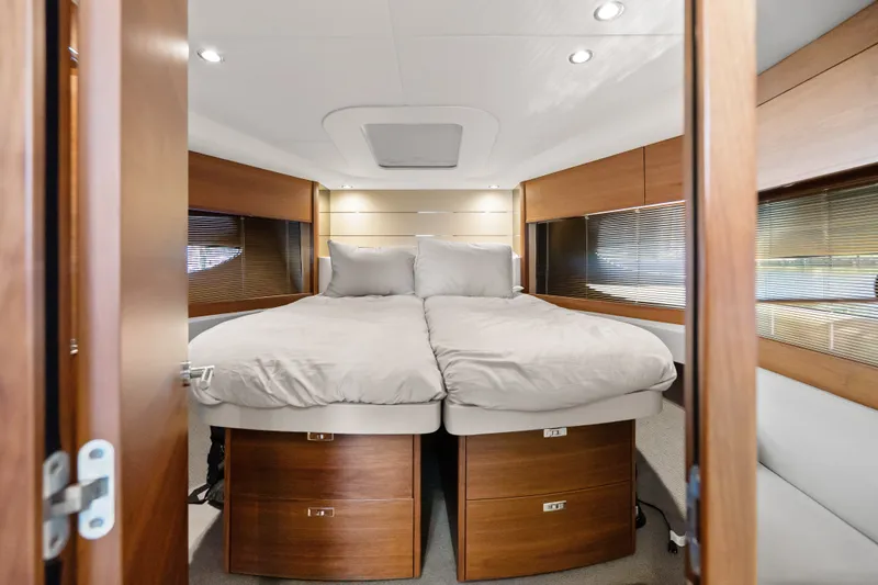 Slide: The Image of Luxurious bedroom interior of 2022 Princess V50 yacht with modern wood finishes. - 20