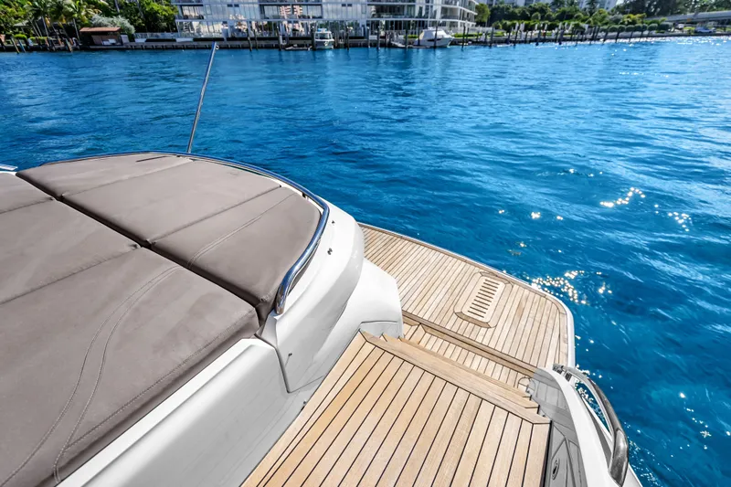 Slide: The Image of Luxury Princess V50 yacht deck with sunbed, 2022 model, overlooking sparkling blue water. - 15