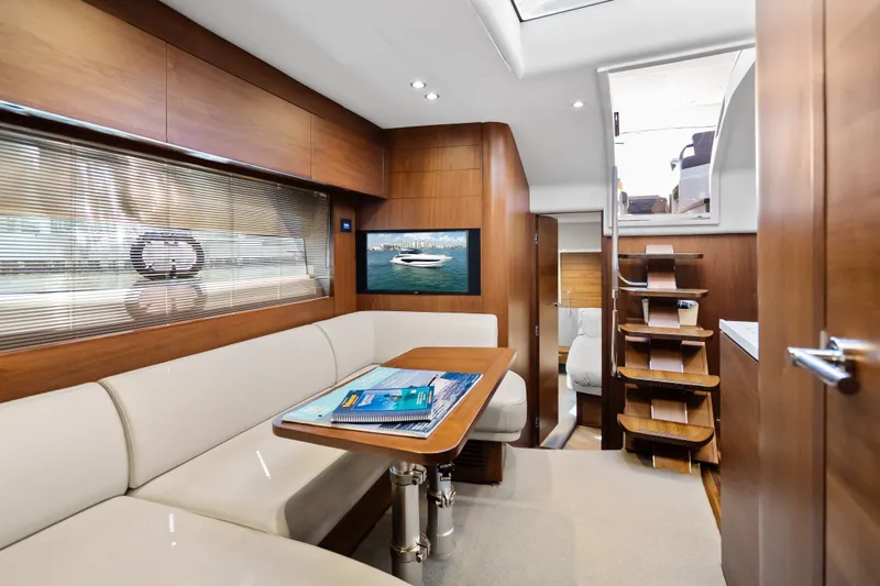 Slide: The Image of Luxurious interior of 2022 Princess V50 yacht with elegant wood finishes and modern seating area. - 19