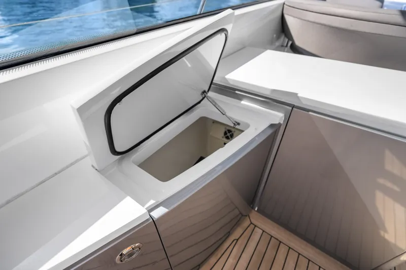 Slide: The Image of Open storage compartment on 2022 Princess V50 yacht with sleek interior design. - 18