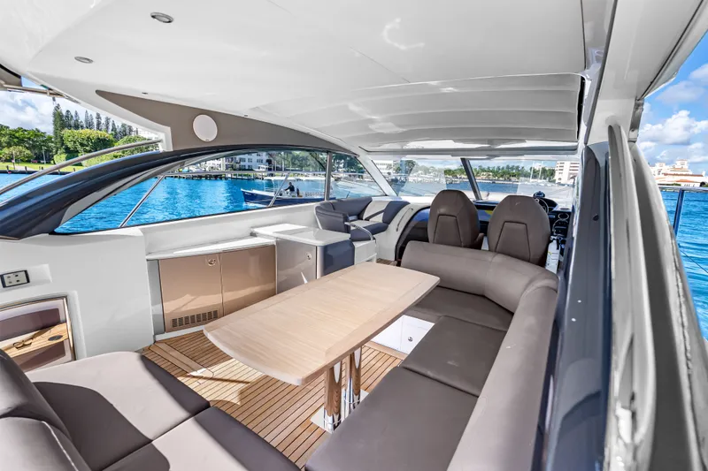 Slide: The Image of Luxurious 2022 Princess V50 yacht interior with elegant seating and scenic ocean view. - 26