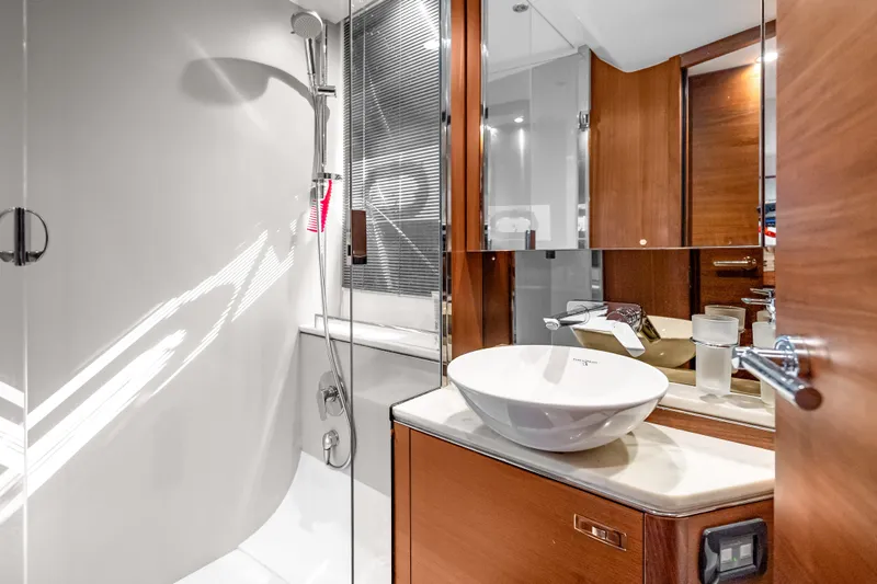 Slide: The Image of Luxurious bathroom in 2022 Princess V50 yacht with modern fixtures and elegant design. - 22