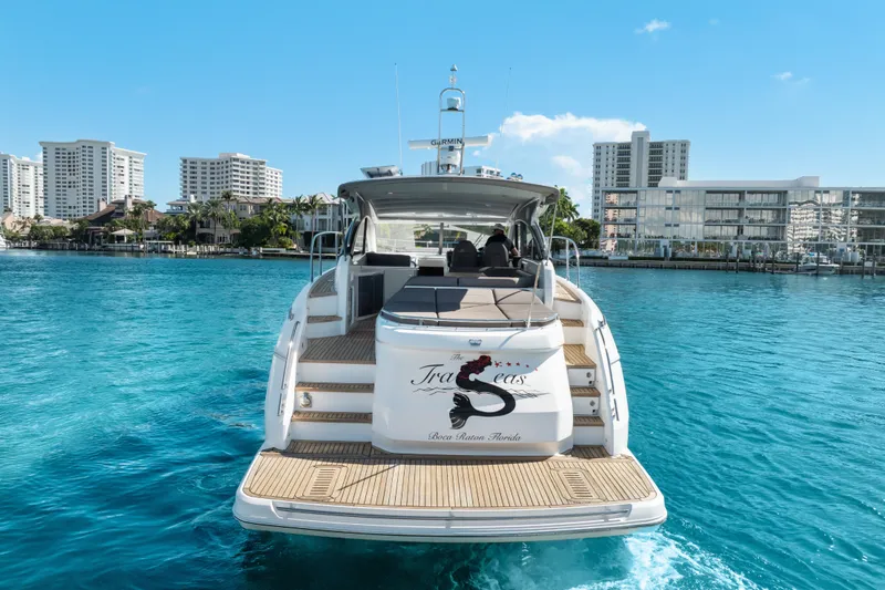 Slide: The Image of Luxury 2022 Princess V50 yacht on clear blue water with city skyline backdrop. - 17