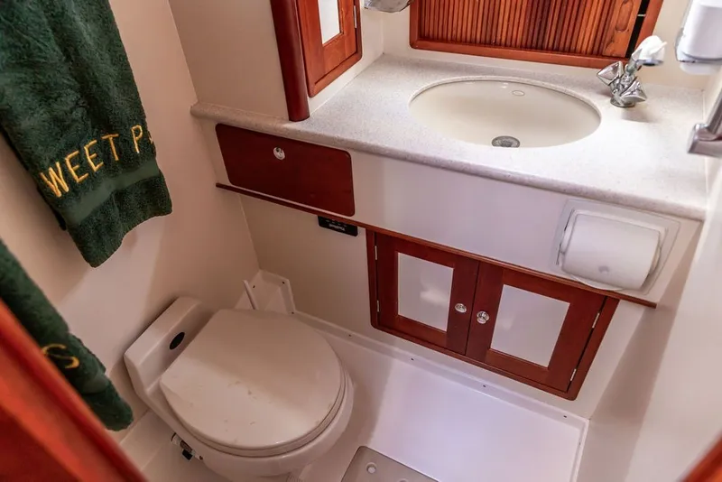 Slide: The Image of Bathroom interior of 2000 Little Harbor WhisperJet 38 yacht, featuring sink and toilet. - 25