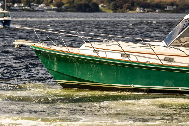 Slide: The Image of Little Harbor WhisperJet 38, 2000 model, cruising on a scenic waterway. - 6