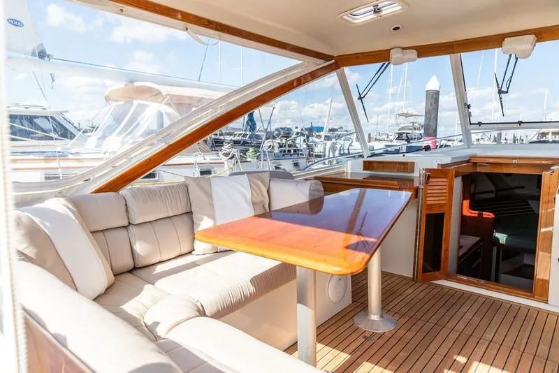 Slide: The Image of Luxurious interior of 2000 Little Harbor WhisperJet 38 yacht with plush seating and wooden table. - 11