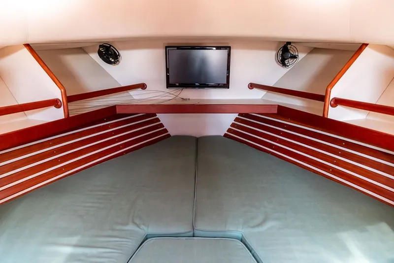 Slide: The Image of Interior cabin of 2000 Little Harbor WhisperJet 38 with bed, TV, and fans. - 28