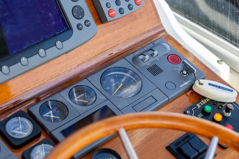 Slide: The Image of Dashboard of a 2000 Little Harbor WhisperJet 38 boat with navigation instruments. - 15