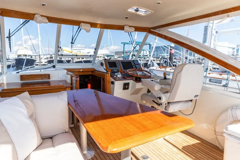 Slide: The Image of Interior of 2000 Little Harbor WhisperJet 38 yacht with helm and seating area. - 10