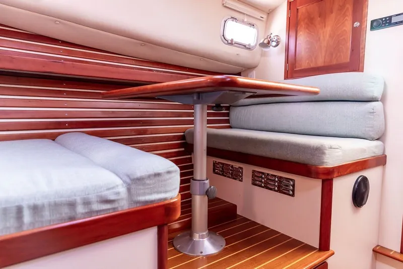 Slide: The Image of Interior of 2000 Little Harbor WhisperJet 38 with wooden accents and cushioned seating. - 23