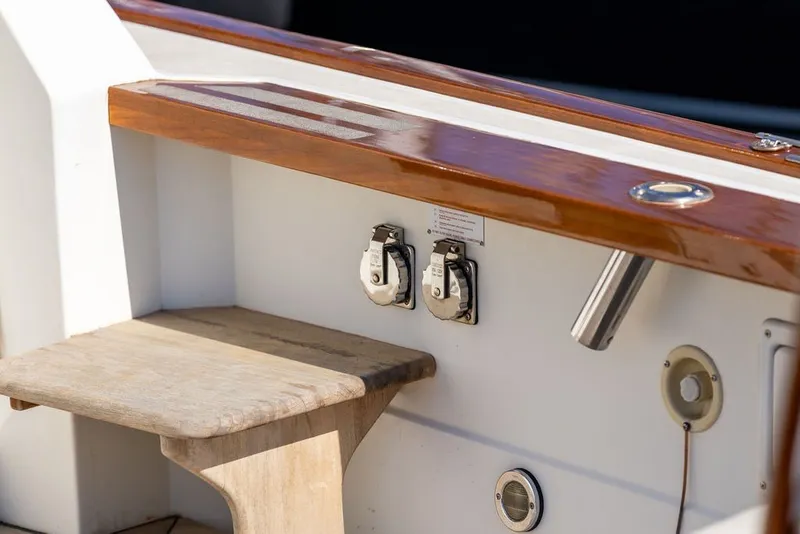 Slide: The Image of Wooden deck detail of 2000 Little Harbor WhisperJet 38 boat, featuring utility outlets. - 36
