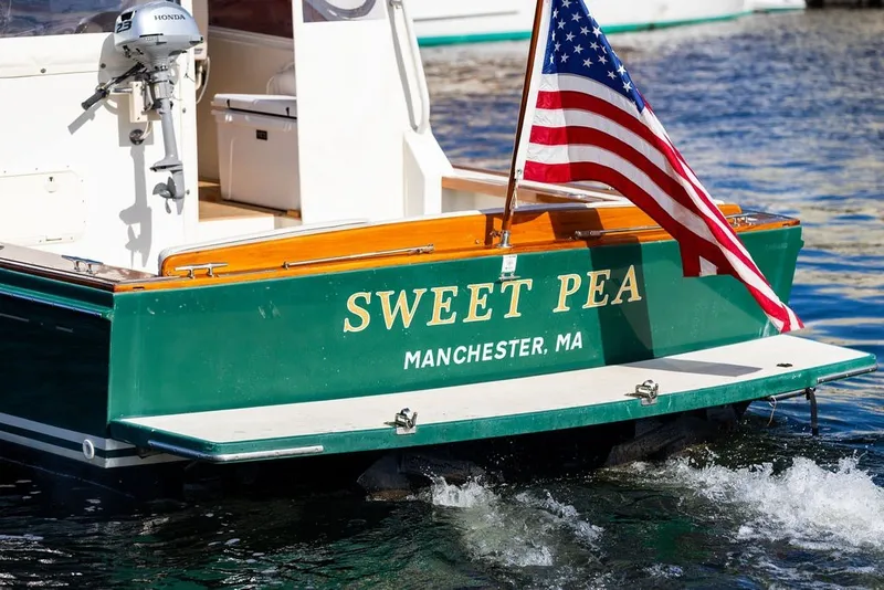 Slide: The Image of Little Harbor WhisperJet 38 boat "Sweet Pea" with American flag, Manchester, MA, 2000 model. - 8