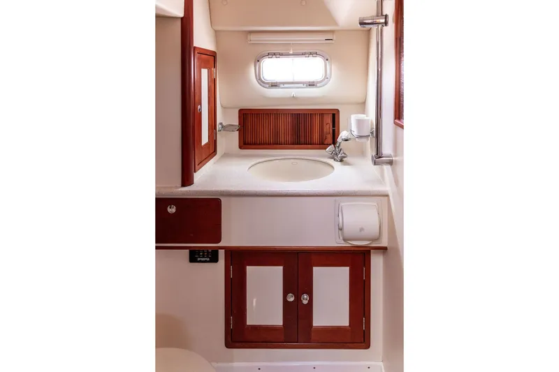 Slide: The Image of Elegant bathroom interior of 2000 Little Harbor WhisperJet 38 yacht with wooden cabinetry. - 26