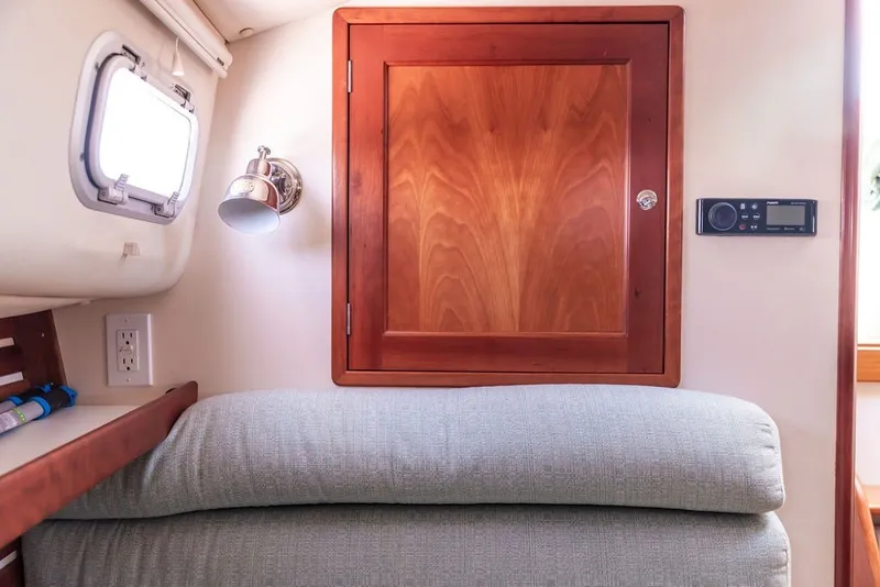 Slide: The Image of Interior cabin of 2000 Little Harbor WhisperJet 38 with wooden cabinet and cozy seating. - 24