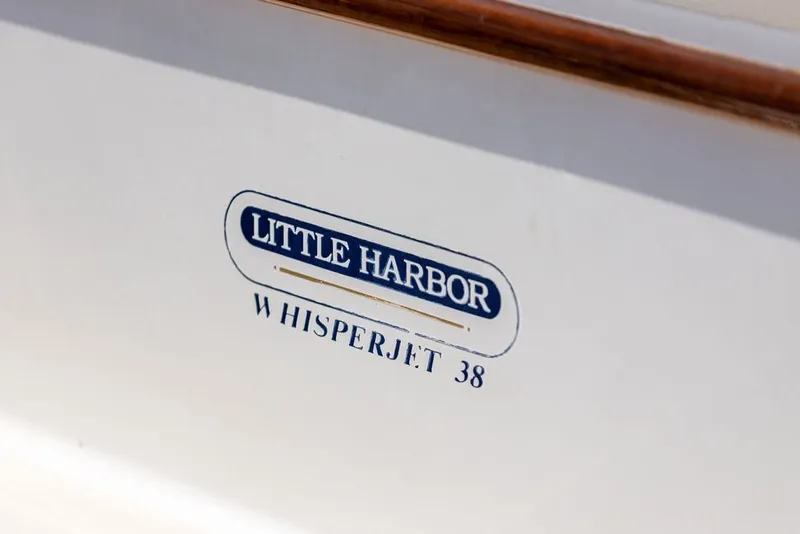 Slide: The Image of 2000 Little Harbor WhisperJet 38 logo on boat hull. - 38