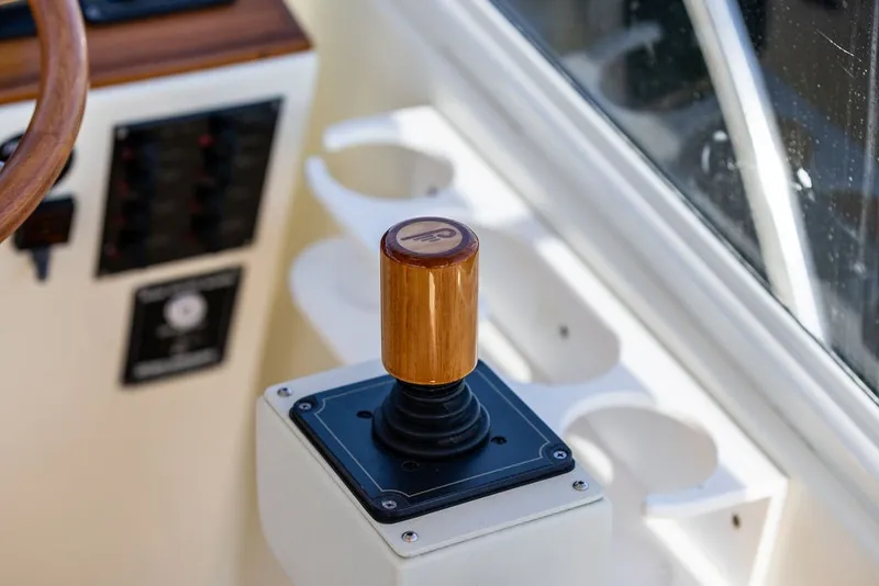 Slide: The Image of Control panel of 2000 Little Harbor WhisperJet 38 boat with wooden joystick. - 18