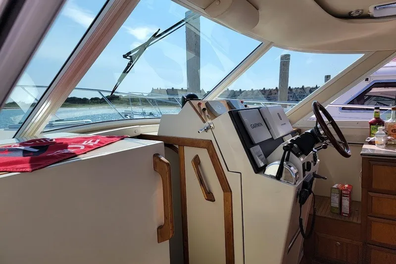 Slide: The Image of Interior view of 2005 Compton 33 Downeast Express HT boat helm with navigation equipment. - 4