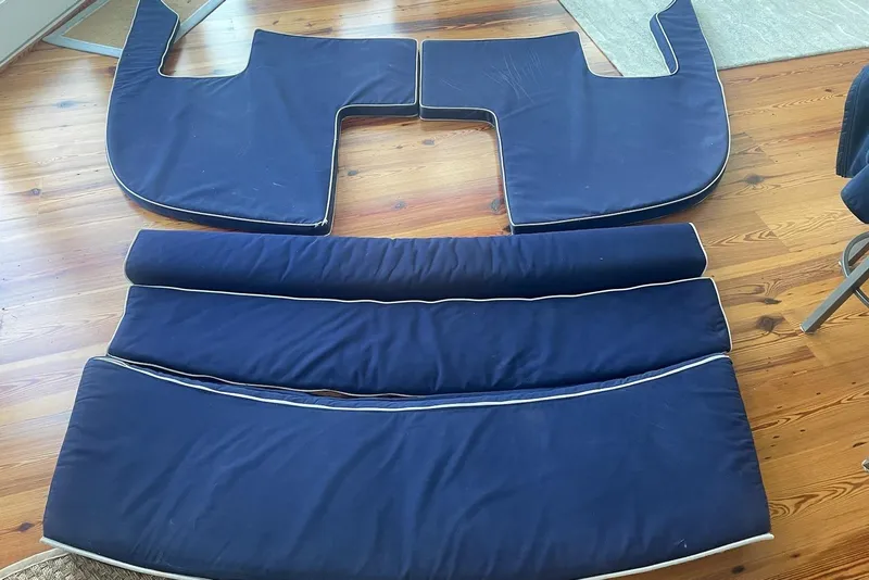 Slide: The Image of Blue boat cushions for 2005 Compton 33 Downeast Express HT on wooden floor. - 30