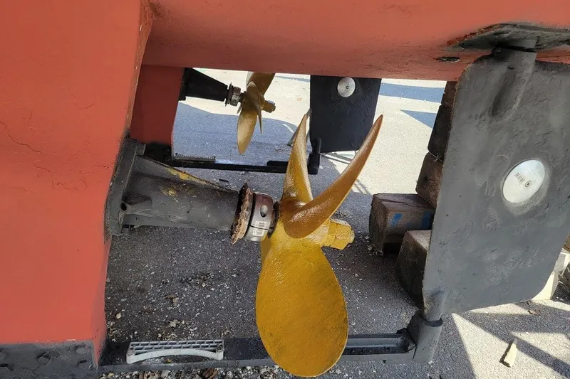 Slide: The Image of Propeller and rudder of 2005 Compton 33 Downeast Express HT boat on dry dock. - 34