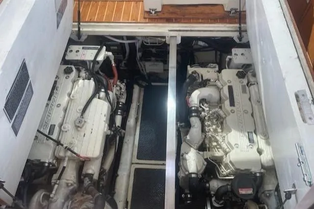 Slide: The Image of Engine compartment of 2005 Compton 33 Downeast Express HT with dual engines. - 19