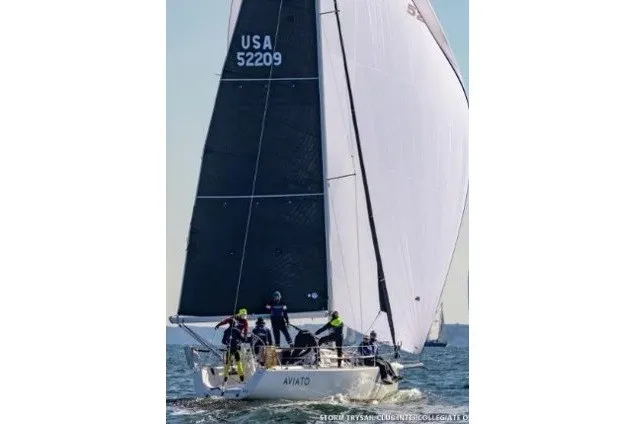 Slide: The Image of 2004 J Boats J/109 sailing on open water with crew, USA 52209 sail number. - 0