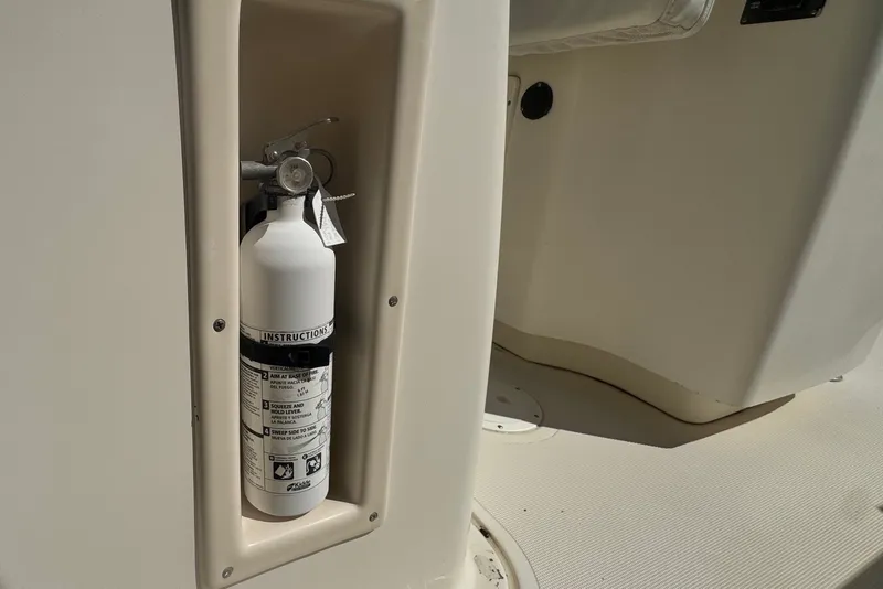 Slide: The Image of Fire extinguisher mounted on 2001 Pursuit 3070 Center Console boat. - 75