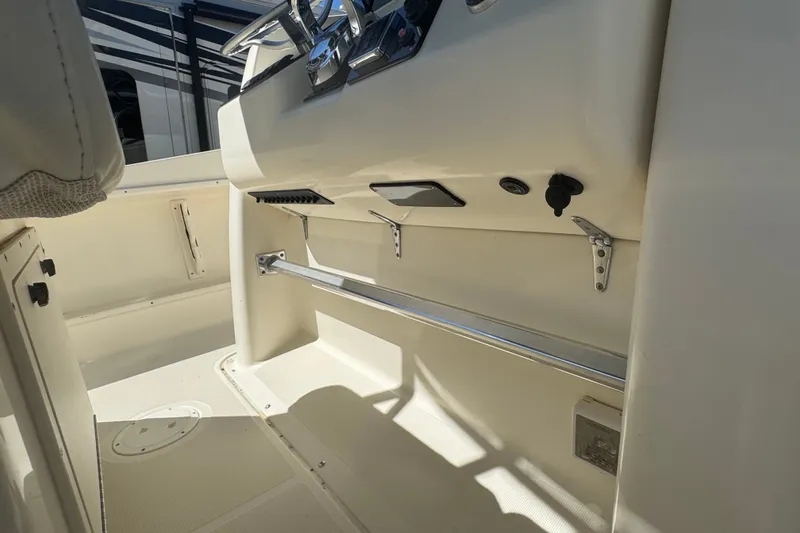 Slide: The Image of 2001 Pursuit 3070 Center Console interior with steering wheel and control panel. - 22