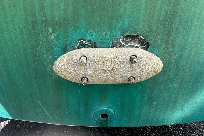 Slide: The Image of Close-up of a 2001 Pursuit 3070 Center Console boat hull with metal plate. - 57