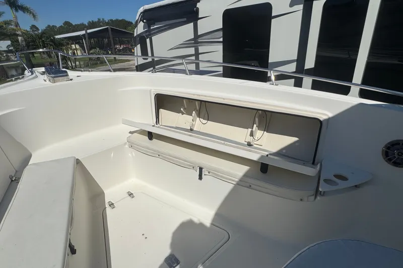 Slide: The Image of 2001 Pursuit 3070 Center Console boat interior with storage compartment and seating. - 46