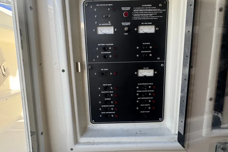 Slide: The Image of Electrical control panel on a 2001 Pursuit 3070 Center Console boat. - 39