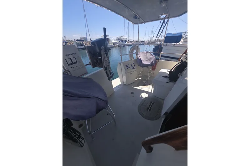 Slide: The Image of 1981 Lancer Motor Sailer cockpit view, docked at marina with clear sky. - 20