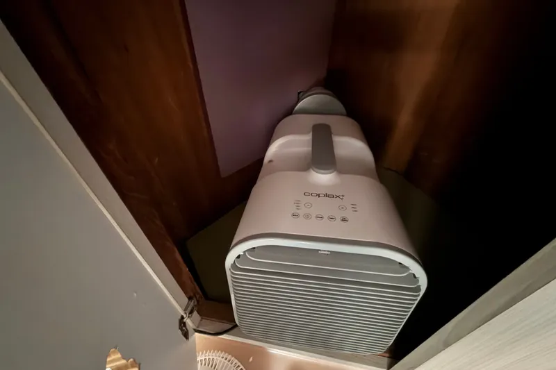 Slide: The Image of Air purifier installed in a wooden cabinet on a 1987 Bluewater Yachts Coastal Cruiser 51. - 60
