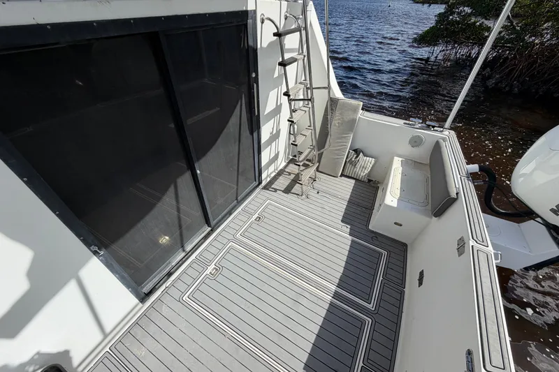 Slide: The Image of 1987 Bluewater Yachts Coastal Cruiser 51 deck with seating and water view. - 20