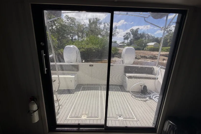 Slide: The Image of 1987 Bluewater Yachts Coastal Cruiser 51 interior view through sliding glass door. - 32