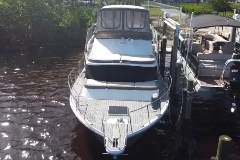 Slide: The Image of 1987 Bluewater Yachts Coastal Cruiser 51 docked at marina, aerial view. - 3