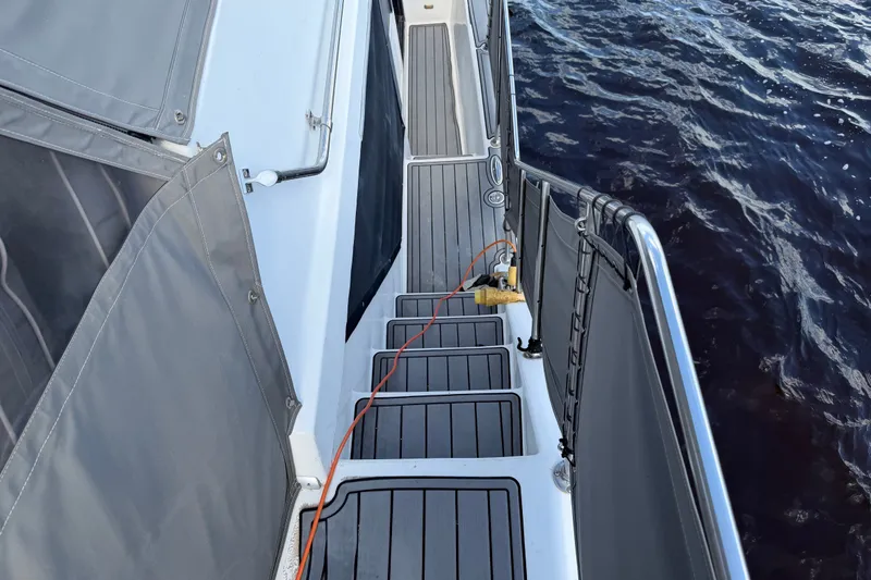 Slide: The Image of 1987 Bluewater Yachts Coastal Cruiser 51 deck with water view and safety railings. - 50