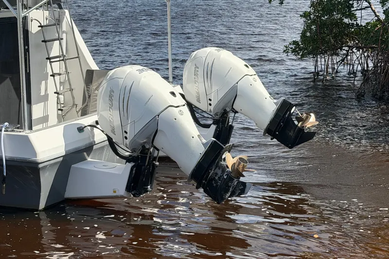 Slide: The Image of 1987 Bluewater Yachts Coastal Cruiser 51 with twin Mercury outboard engines. - 11