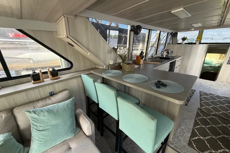Slide: The Image of Interior of 1987 Bluewater Yachts Coastal Cruiser 51 with modern kitchen and seating area. - 33