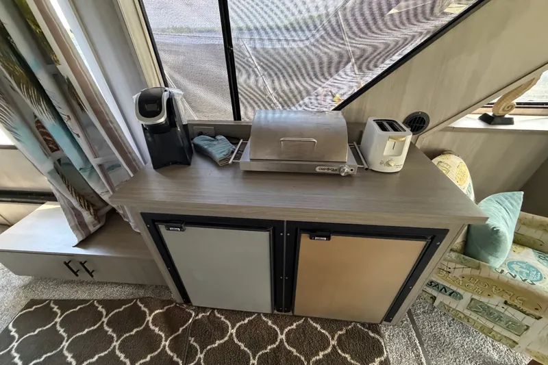 Slide: The Image of 1987 Bluewater Yachts Coastal Cruiser 51 interior with appliances and storage cabinets. - 37