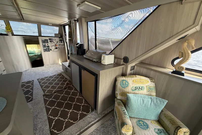 Slide: The Image of Interior of 1987 Bluewater Yachts Coastal Cruiser 51 with nautical decor and helm station. - 34