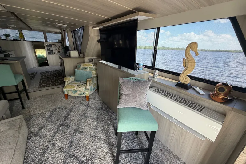 Slide: The Image of Interior of 1987 Bluewater Yachts Coastal Cruiser 51 with modern decor and large windows. - 26